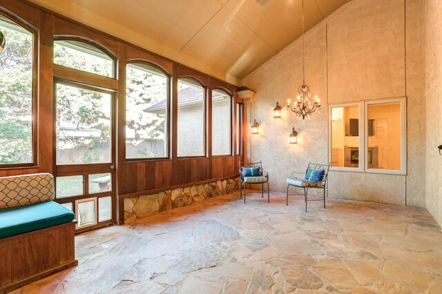 sunroom with vaulted ceiling and plenty of natural light