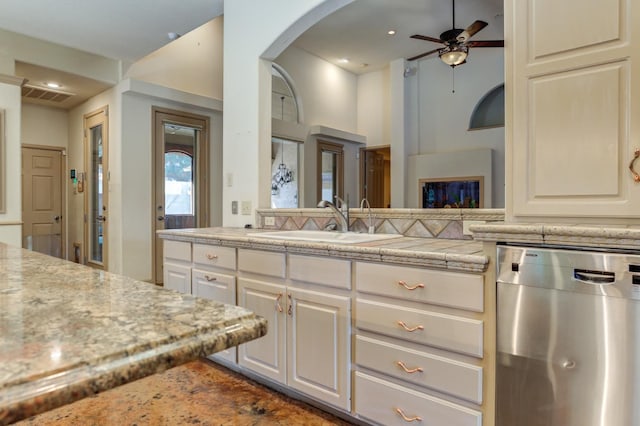 kitchen with white cabinetry, ceiling fan, dishwasher, and sink