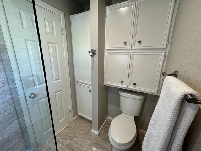 bathroom featuring toilet