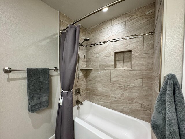 bathroom with shower / tub combo