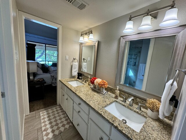 bathroom featuring tile patterned floors and vanity