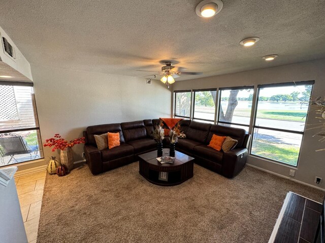 living room featuring carpet flooring and ceiling fan