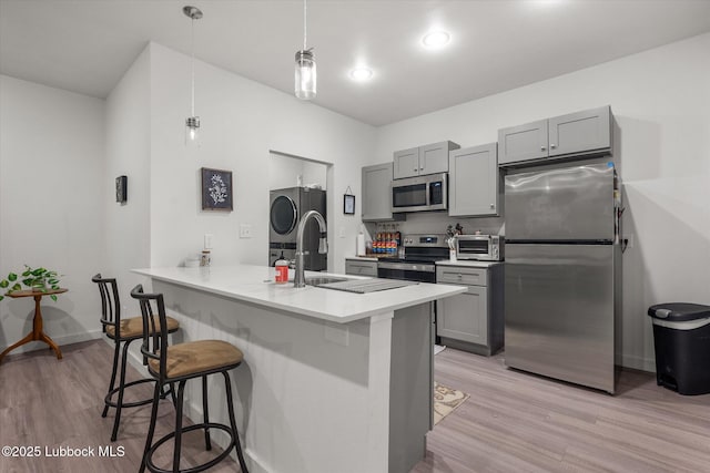 1203 N Evanston Ave, Lubbock, TX 79416 - kitchen featuring appliances with stainless steel finishes, gray cabinets, and light wood-style flooring
