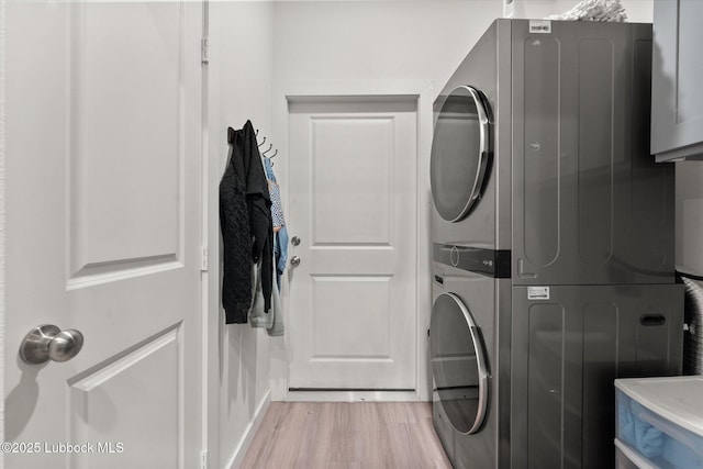 1203 N Evanston Ave, Lubbock, TX 79416 - laundry room featuring stacked washing machine and dryer and light wood-style floors