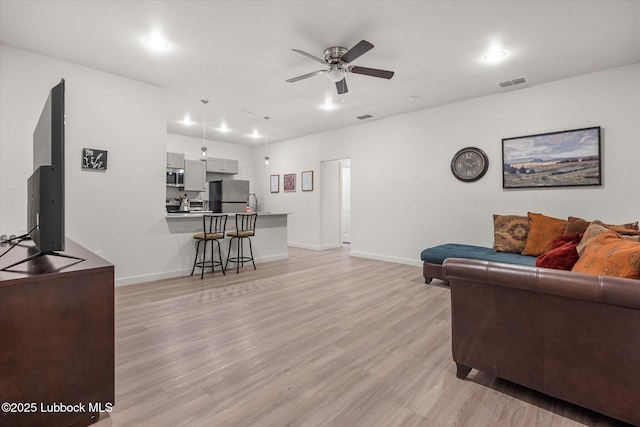 1203 N Evanston Ave, Lubbock, TX 79416 - living area featuring ceiling fan, light wood-style flooring, and recessed lighting