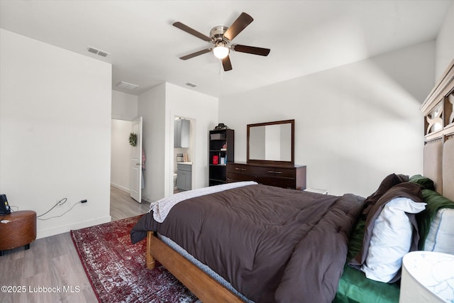 1203 N Evanston Ave, Lubbock, TX 79416 - bedroom with light wood finished floors and ceiling fan