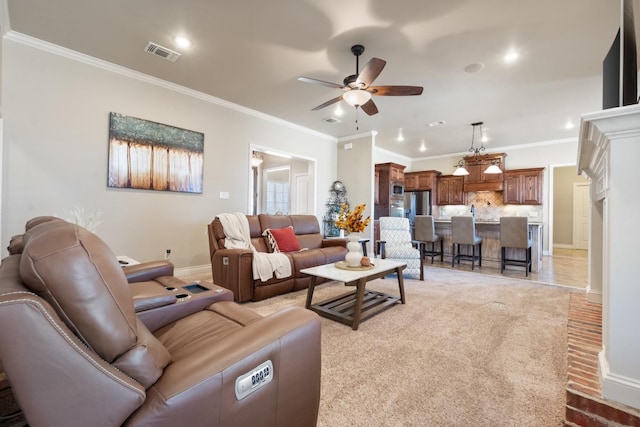 living area featuring visible vents, recessed lighting, crown molding, baseboards, and ceiling fan