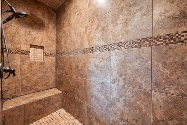 room details with a tile shower