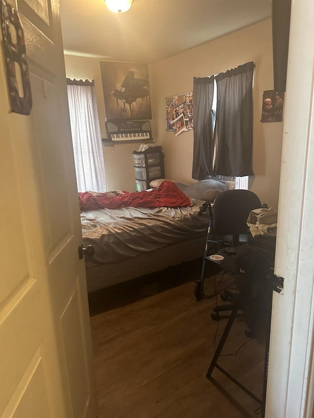 bedroom with wood-type flooring