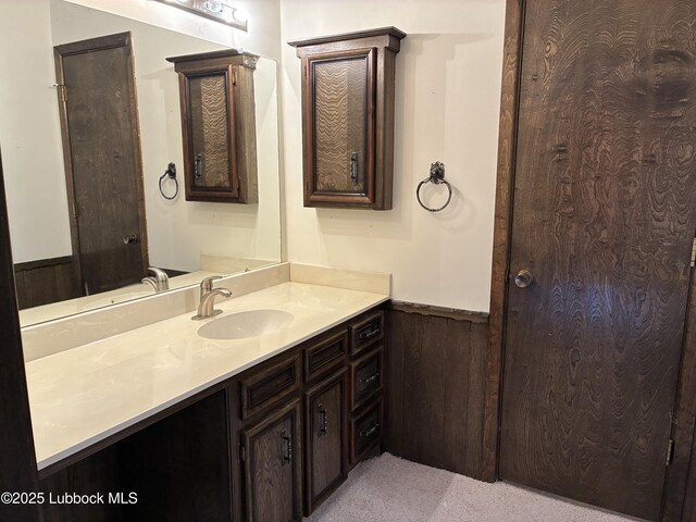 1423 Cherry Blossom Dr, Littlefield, TX 79339 - bathroom featuring wainscoting and vanity