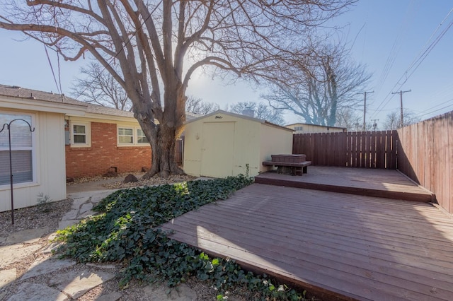 wooden deck with a storage shed