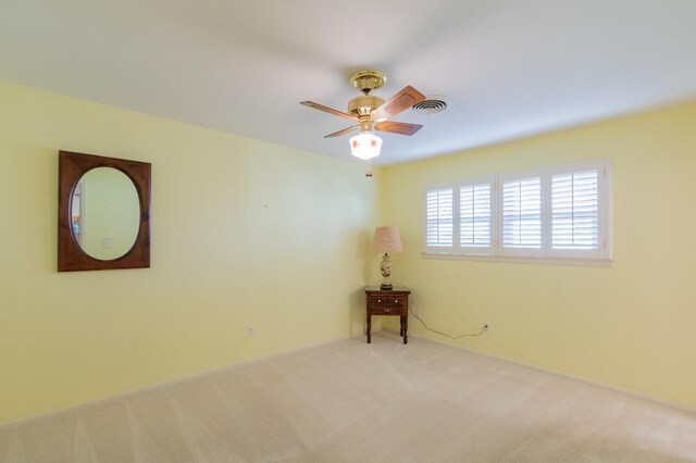 carpeted empty room with ceiling fan