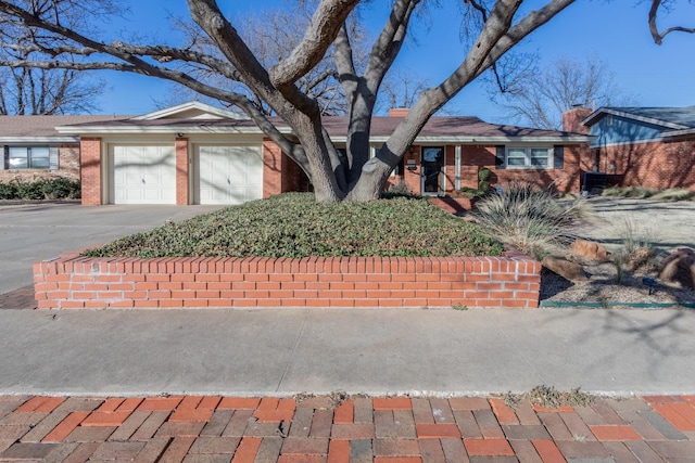 single story home with a garage