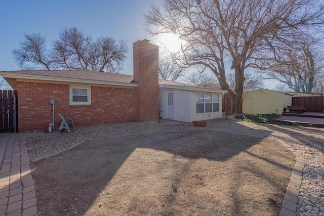 rear view of property with a wooden deck