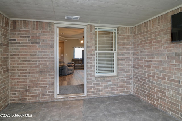 5901 102nd St, Lubbock, TX 79424 - doorway to property featuring brick siding