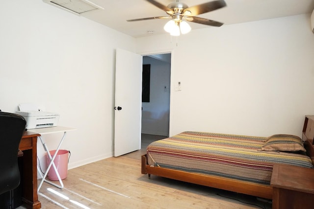 bedroom with ceiling fan and light hardwood / wood-style floors