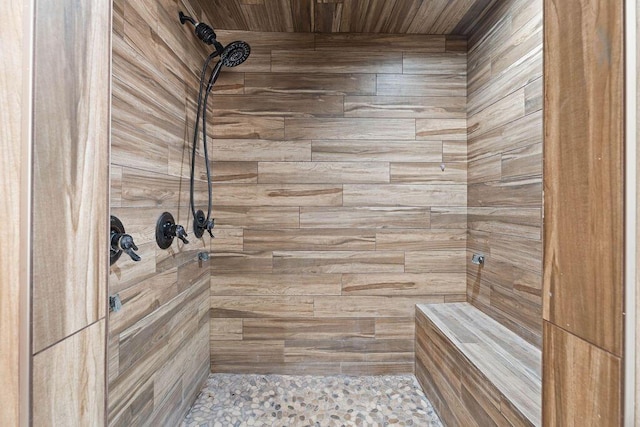full bath featuring tiled shower