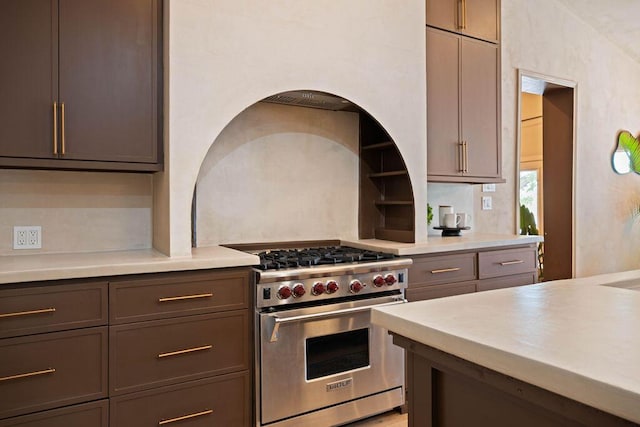 kitchen with luxury stove and light countertops