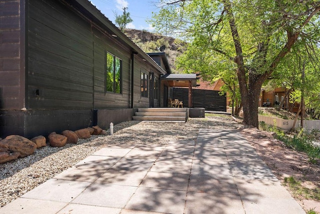 view of side of home with fence