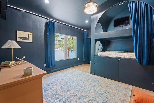 bedroom featuring recessed lighting, vaulted ceiling, and wood finished floors