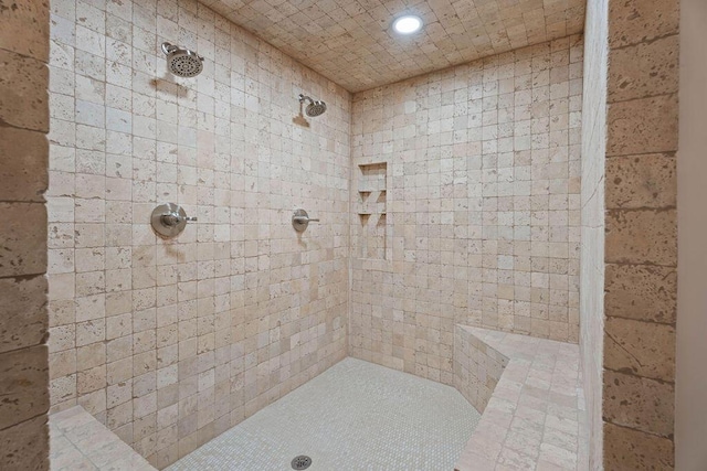 bathroom featuring recessed lighting and a tile shower