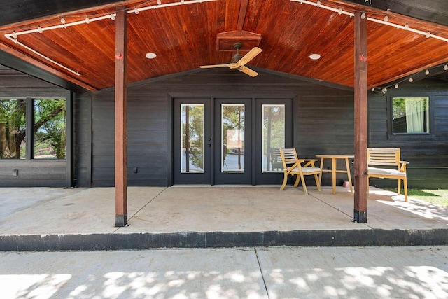 property entrance featuring a patio area, french doors, and ceiling fan