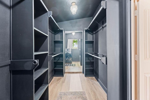 walk in closet featuring wood finished floors