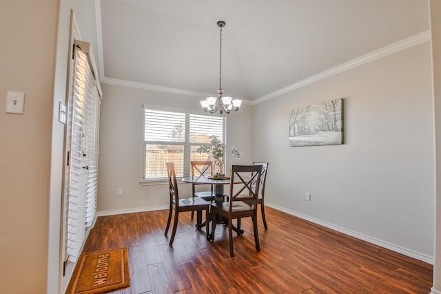 dining space with ornamental molding, dark hardwood / wood-style floors, and a chandelier