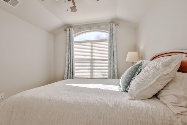 bedroom with ceiling fan and vaulted ceiling