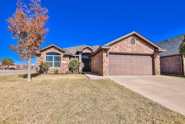 ranch-style home with a garage and a front lawn