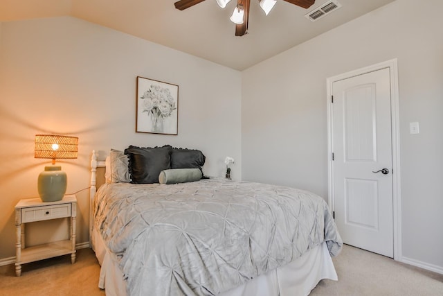 carpeted bedroom with vaulted ceiling and ceiling fan