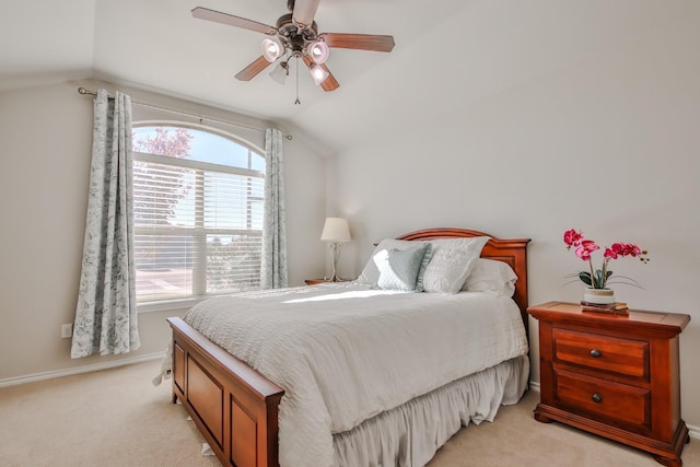 bedroom with lofted ceiling, light carpet, and ceiling fan