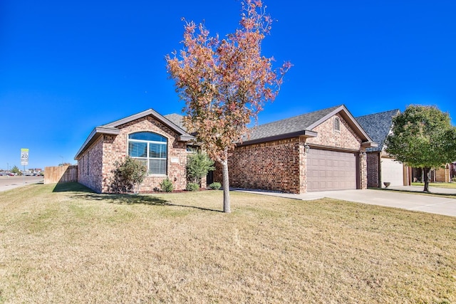 single story home featuring a garage and a front yard