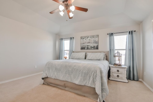 carpeted bedroom featuring ceiling fan and lofted ceiling