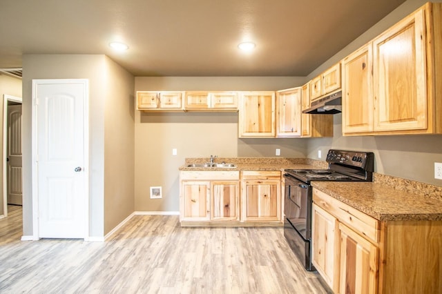 kitchen featuring light brown cabinetry, sink, electric range, light stone counters, and light wood-type flooring