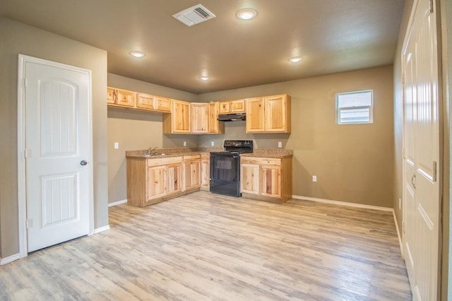 kitchen with sink, light hardwood / wood-style flooring, light stone countertops, black / electric stove, and light brown cabinets