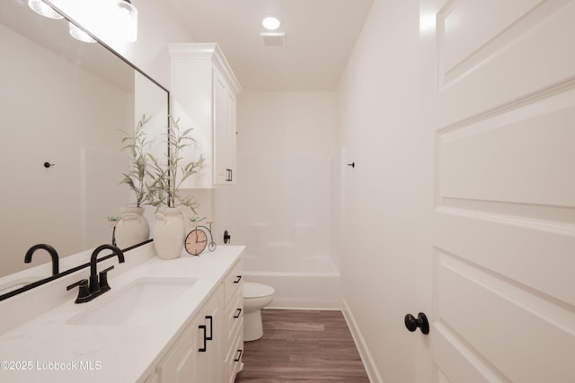 5005 Prentiss Ave, Lubbock, TX 79407 - full bath featuring vanity, wood finished floors, and washtub / shower combination
