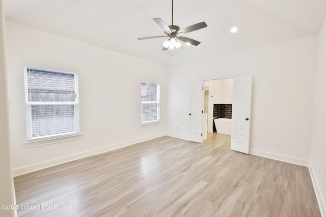 5005 Prentiss Ave, Lubbock, TX 79407 - unfurnished room featuring healthy amount of natural light, light wood-type flooring, ceiling fan, and vaulted ceiling