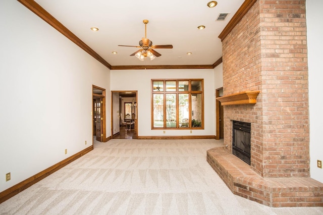 unfurnished living room with light carpet, a brick fireplace, ornamental molding, and ceiling fan