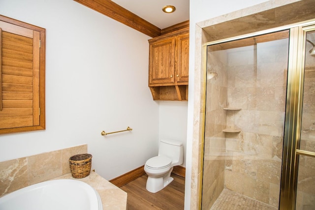 bathroom featuring crown molding, wood-type flooring, independent shower and bath, and toilet