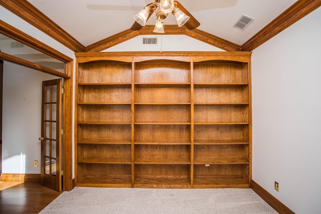 interior space featuring ornamental molding, vaulted ceiling, carpet floors, and ceiling fan