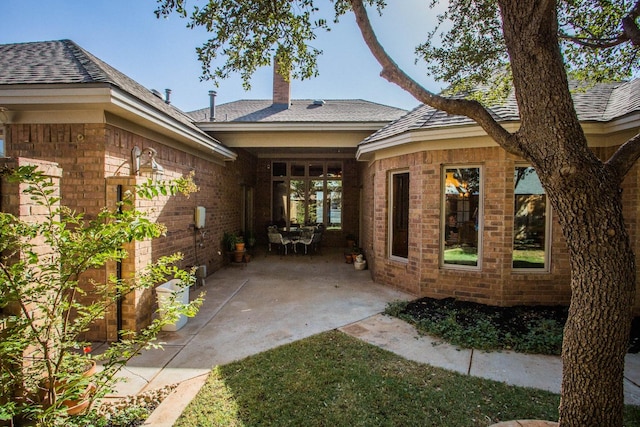 rear view of property with a patio area