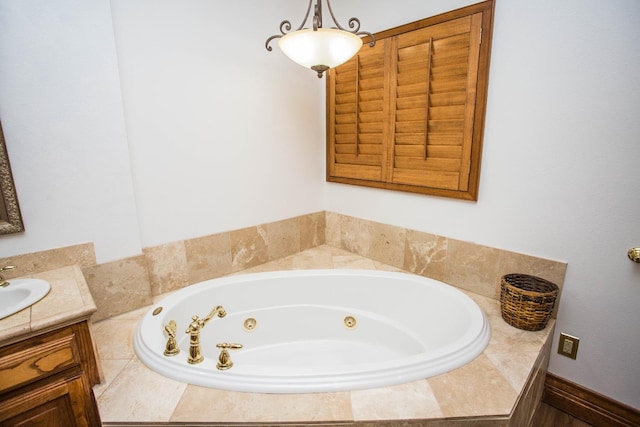 bathroom with vanity and a relaxing tiled tub