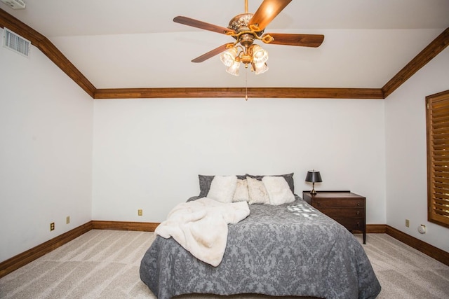 carpeted bedroom featuring crown molding, ceiling fan, and lofted ceiling