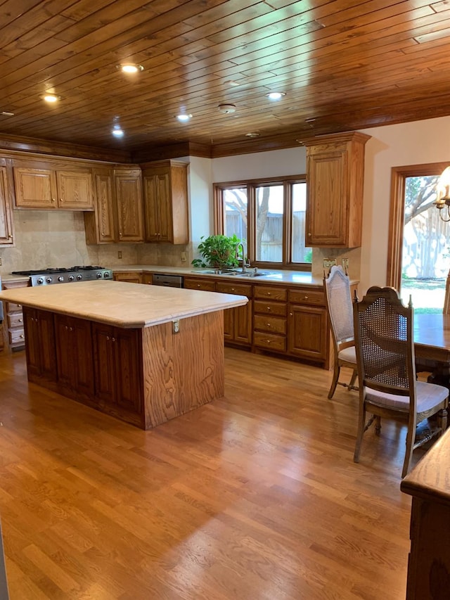 kitchen featuring backsplash, light hardwood / wood-style flooring, wooden ceiling, and a center island