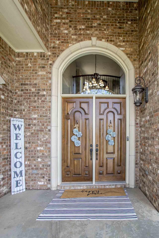 4009 109th St, Lubbock, TX 79423 - doorway to property featuring brick siding