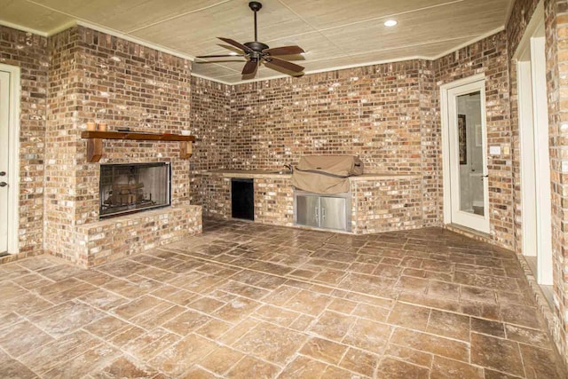 4009 109th St, Lubbock, TX 79423 - view of patio featuring area for grilling, a fireplace, and a ceiling fan