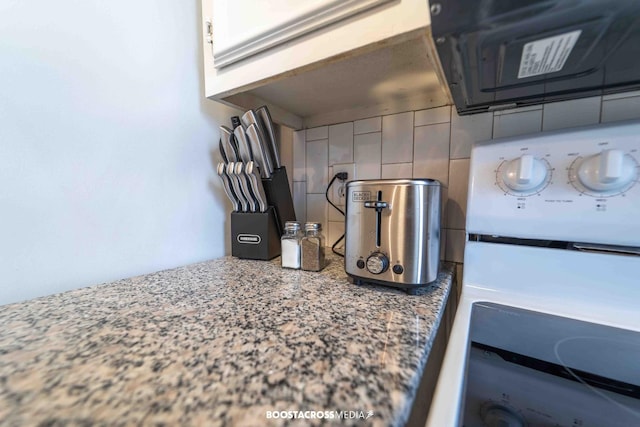 interior details with stone counters and white cabinets