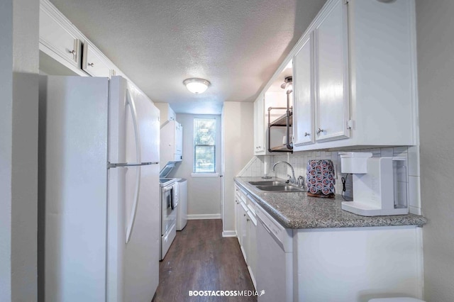 kitchen featuring sink, white appliances, decorative backsplash, and white cabinets