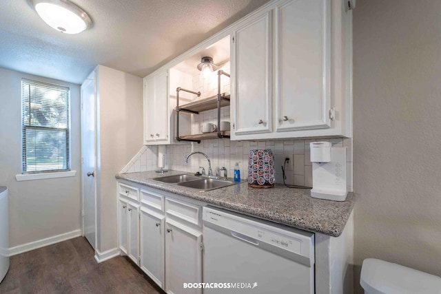 kitchen with sink, dishwasher, white cabinetry, tasteful backsplash, and dark hardwood / wood-style flooring